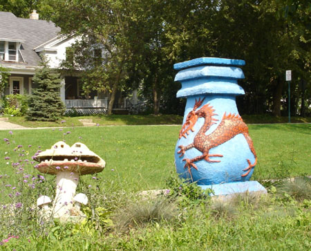 Sid Boyum's sculptures  on smiling mushroom and blue dragon urn in the Schenk-Atwood Neighborhood in Madison, Wisconsin